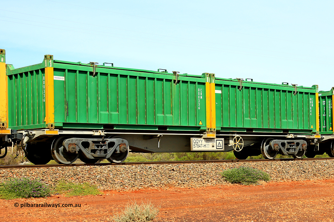 231020 8238
Parkeston, QQYY type 40' container waggon QQYY 57847 one of five hundred ordered by Aurizon and built by CRRC Yangtze Group of China in 2022. In service with two loaded 20' half height hard top 'rotainers' lettered CRM, for Cristal Mining before they were absorbed into Tronox, CRM 001044 with Cristal decal and yellow corner posts and CRM 000336 with Tronox decal and yellow corner posts, on Aurizon's Tronox mineral sands train 4UP1 from Ivanhoe / Broken Hill (NSW) to Kwinana (WA). 20th of October 2023.
Keywords: QQYY-type;QQYY57847;CRRC-Yangtze-Group-China;