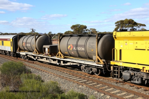 160525 4861
West Kalgoorlie, Aurizon intermodal train 2MP1. Inline fuelling waggon QQFY 4271, originally built for Commonwealth Railways in 1976 by Perry Engineering SA as type RMX, recoded to AQMX, 70 tonne bogies became AQMY, then RQMY, to QR National in 2007. Seen here with two 30' diesel fuel tanktainers from Nantong Tank Container Company, NTTU 330006[9] and NTTU 330001[1] each with a 30800 litre capacity, and fuel transfer or pump unit QRIP 06.
Keywords: QQFY-type;QQFY4271;Perry-Engineering-SA;RMX-type;AQMX-type;AQMY-type;RQMY-type;