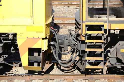 160525 4937
West Kalgoorlie, Aurizon intermodal train 2MP1, coupling between locomotives, shows the MU or Multiple Unit cable going into the socket with the red cap, below that with the crimp fitting is the in-line fuel hose between locomotives. Then you also have the train brake pipe and loco control lines and of course the couplers.
