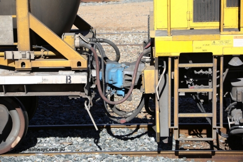 160525 4945
West Kalgoorlie, Aurizon intermodal train 2MP1. Coupling between second unit locomotive and the inline fuelling waggon QQFY 4271, shows the MU or Multiple Unit red cable going into the socket with the cream cap on the waggon and the red cap on the loco, behind that is the crimp fitting is the in-line fuel hose between waggon and the loco along with train air pipe and coupling.
Keywords: QQFY-type;QQFY4271;Perry-Engineering-SA;RMX-type;AQMX-type;AQMY-type;RQMY-type;