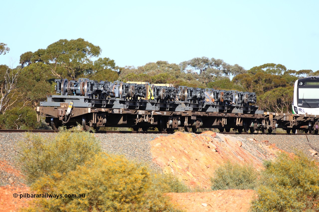160522 2078
Binduli, 5MP2 steel train, view from rear looking at NQOY 15056 and RQCY 701 loaded with bogies for Trans-Perth B set 116. NQOY type waggon built by Comeng NSW in batch of seventy OCY type waggons in 1974/75.
Keywords: NQOY-type;NQOY15056;Comeng-NSW;OCY-type;RQCY-type;RQCY701;