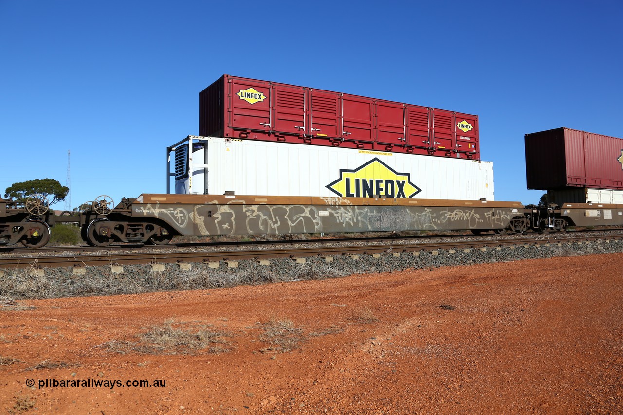 160522 2102
Parkeston, 6MP4 intermodal train, platform 1 of 5-pack RRRY 7014 well waggon set, one of nineteen built in China at Zhuzhou Rolling Stock Works for Goninan in 2005, Linfox reefer FCAD 9106136 and half height side door red Linfox LSDU 6940002 container.
Keywords: RRRY-type;RRRY7014;CSR-Zhuzhou-Rolling-Stock-Works-China;