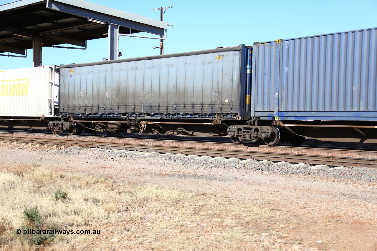 160522 2147
Parkeston, 6MP4 intermodal train, platform 3 of 5 on RRQY 7323 5 pack articulated skel waggon set built by Qiqihar Rollingstock Works China in 2005 for Pacific National, with a curtainsider container of the owner PNXC 4492.
Keywords: RRQY-type;RRQY7323;Qiqihar-Rollingstock-Works-China;