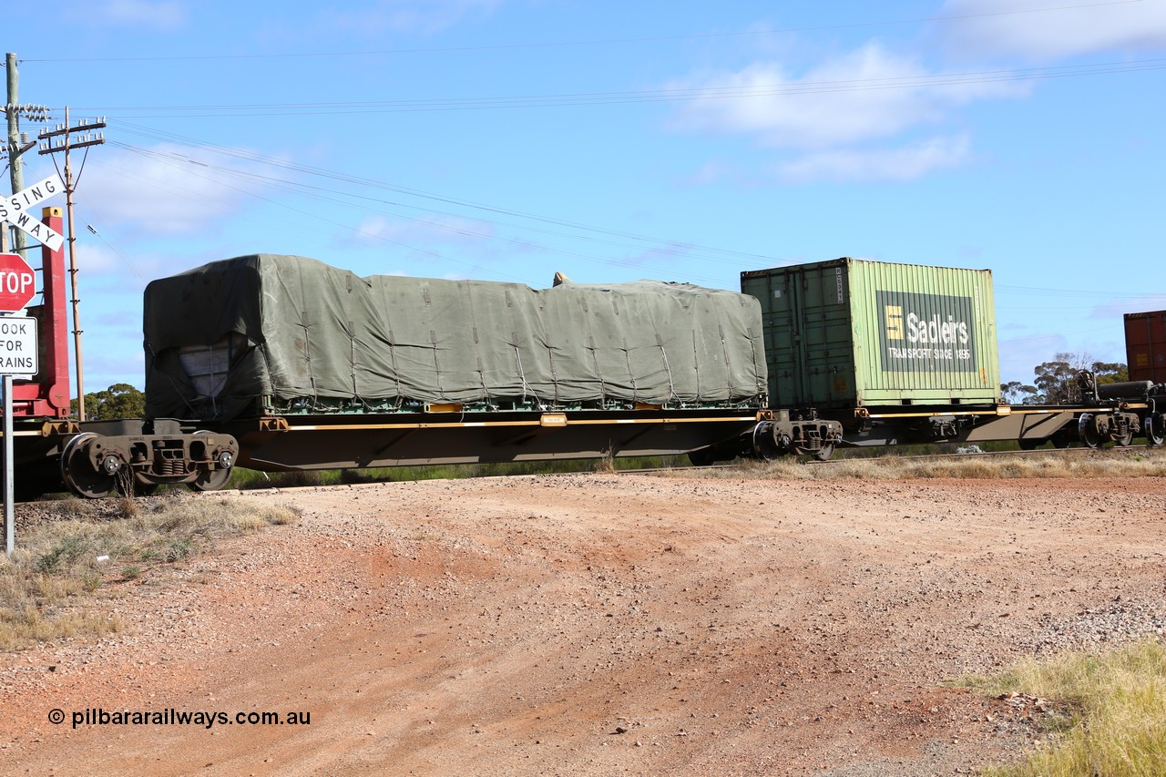 160522 2344
Parkeston, 7MP7 priority service train, platform 2 of 5-pack articulated skel waggon set, Qiqihar Rollingstock Works China built RRQY 5816, 40' flatrack with tarped load.
Keywords: RRQY-type;RRQY8516;Qiqihar-Rollingstock-Works-China;