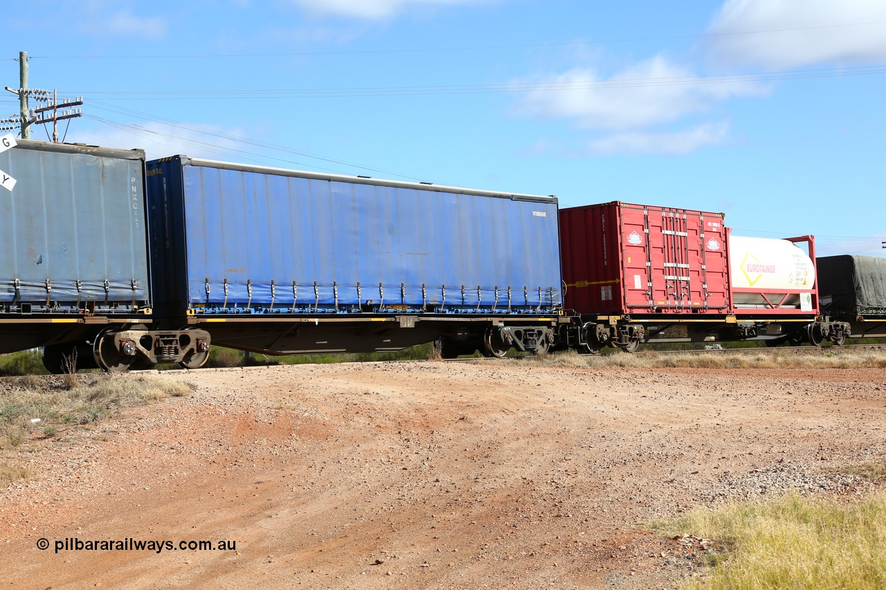 160522 2348
Parkeston, 7MP7 priority service train, RRAY 7190 platform 1 of 5-pack articulated skel waggon set, 1 of 100 built by ABB Engineering NSW 1996-2000, 40' Royal Wolf curtainsider RWTU 903058.
Keywords: RRAY-type;RRAY7190;ABB-Engineering-NSW;