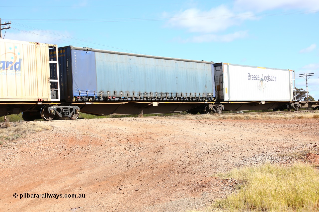 160522 2368
Parkeston, 7MP7 priority service train, RRAY 7244 platform 3 of 5-pack articulated skel waggon set, 1 of 100 built by ABB Engineering NSW 1996-2000, 48' deck, Pacific National curtainsider PNXM 4529.
Keywords: RRAY-type;RRAY7244;ABB-Engineering-NSW;