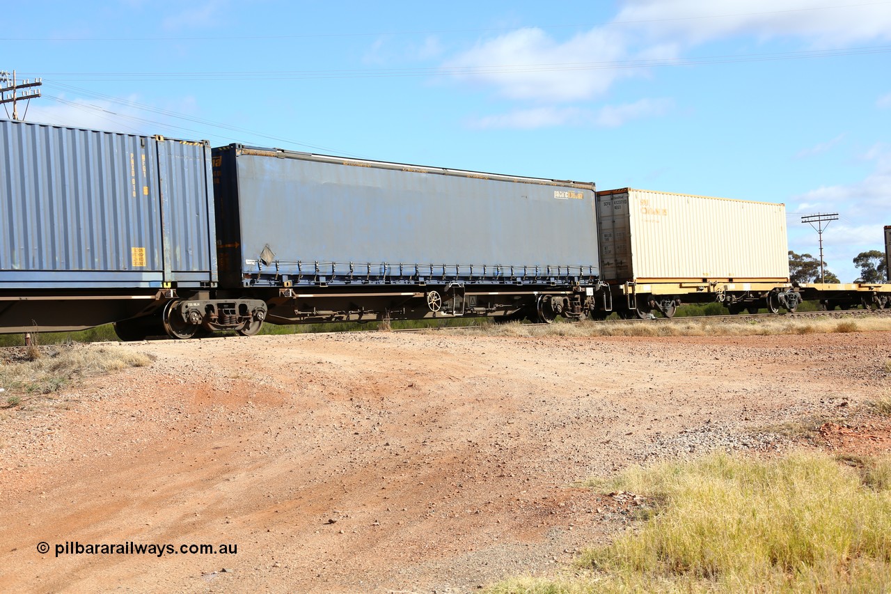 160522 2396
Parkeston, 7MP7 priority service train, platform 1 of 5 on RRQY 8344 5-pack articulated skeletal waggon set the last of a batch of 41 built by Qiqihar Rollingstock Works China in 2005 for Pacific National, with a 48' Pacific National curtainsider PNXM 5210.
Keywords: RRQY-type;RRQY8344;Qiqihar-Rollingstock-Works-China;