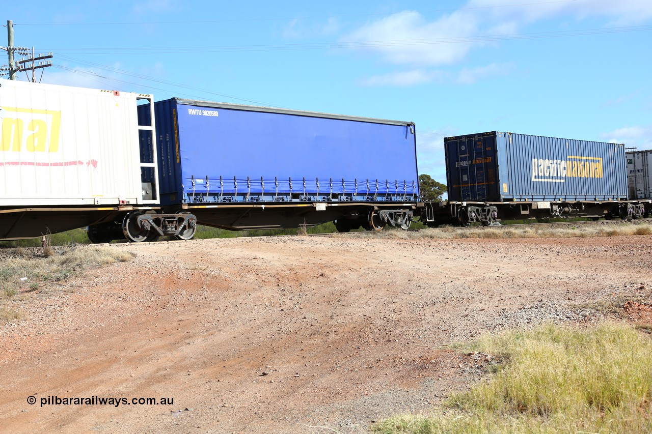 160522 2402
Parkeston, 7MP7 priority service train, RRAY 7208 platform 1 of 5-pack articulated skeletal waggon set, part of one hundred built by ABB Engineering NSW 1996-2000, 40' deck with Royal Wolf 40' curtainsider RWTU 9020580.
Keywords: RRAY-type;RRAY7208;ABB-Engineering-NSW;