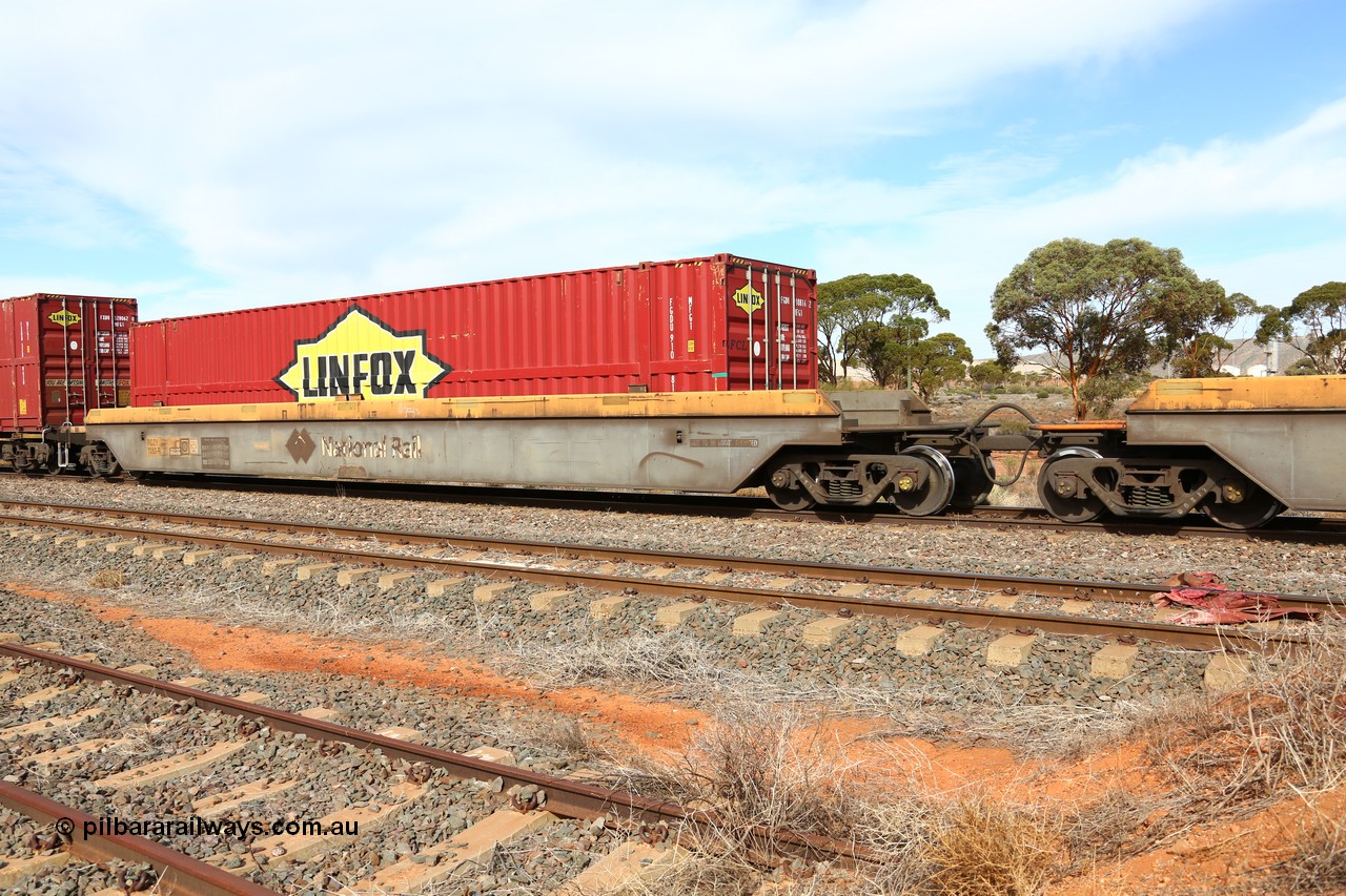 160523 2965
Parkeston, 7SP3 intermodal train, RQZY 7053 platform 1 of five unit bar coupled well container waggon set built in a batch of thirty two by Goninan NSW in 1995/96, loaded with Linfox 48' container FGDU 910816.
Keywords: RQZY-type;RQZY7053;Goninan-NSW;