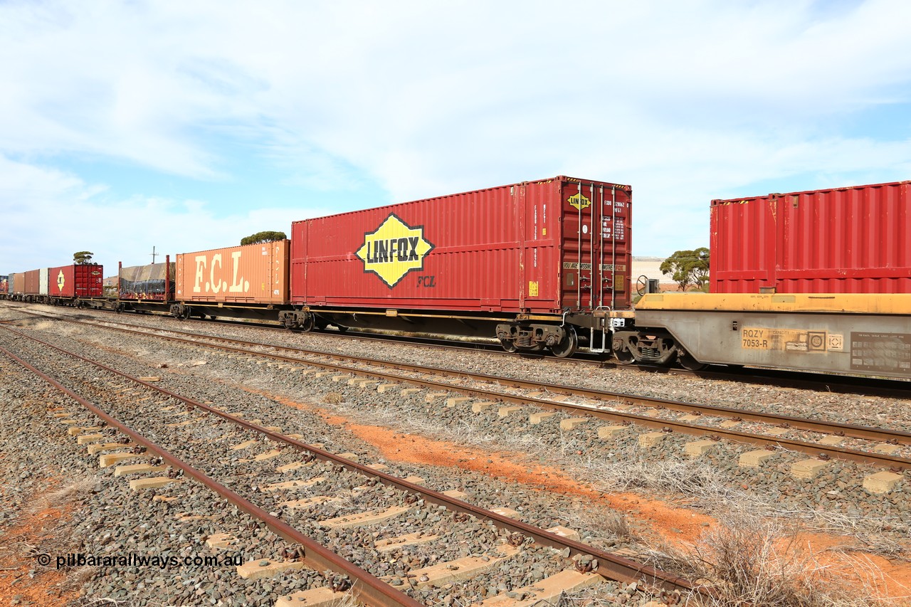 160523 2966
Parkeston, 7SP3 intermodal train, RRQY 8519 5-pack articulated skel waggon set built by Qiqihar Rollingstock Works, China in 2015, loaded with a 48' Linfox-FCL high box, 48' FCL and Linfox boxes and a 40' flatrack.
Keywords: RRQY-type;RRQY8519;Qiqihar-Rollingstock-Works-China;