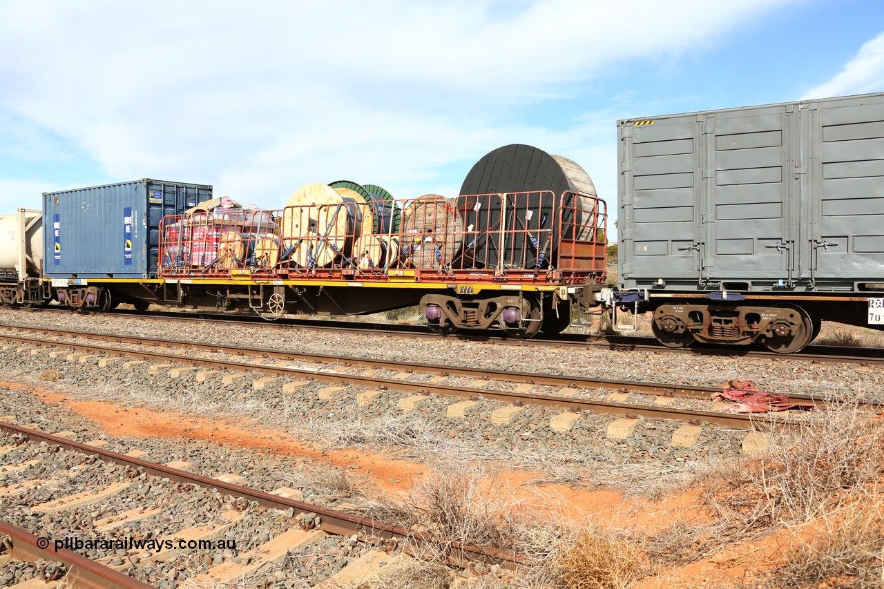 160523 2974
Parkeston, 7SP3 intermodal train, RQFY 47 container waggon, built by Victorian Railways Newport Workshops in 1978 in a batch of twenty as QMX type skeletal container waggons, recoded to VQFX, RQFX, RQFF, August 1995 2CM bogies fitted and to RQFY. A 40' Simon FD flatrack FD 146 loaded with cable drums and Royal Wolf 20' box RWLU 096014.
Keywords: RQFY-type;RQFY47;Victorian-Railways-Newport-WS;QMX-type;VQFX-type;RQFX-type;RQFF-type;