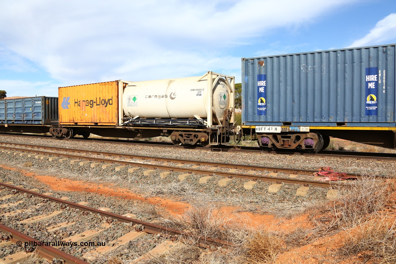 160523 2975
Parkeston, 7SP3 intermodal train, RRGY 7142 platform 5, RRGY type is a 5-pack articulated skeletal container waggon, one of fifty originally built by AN Rail Islington Workshops in 1996-97 as type RRBY, later rebuilt with 48' intermediate decks and recoded to RRGY. Loaded with a 20' ISO 22T8 type tank for coregas CGBU 000003 [6] with argon and a 20' 22G1 type box for Hapag-Lloyd HLXU 205028 [1].
Keywords: RRGY-type;RRGY7142;AN-Islington-WS;RRBY-type;