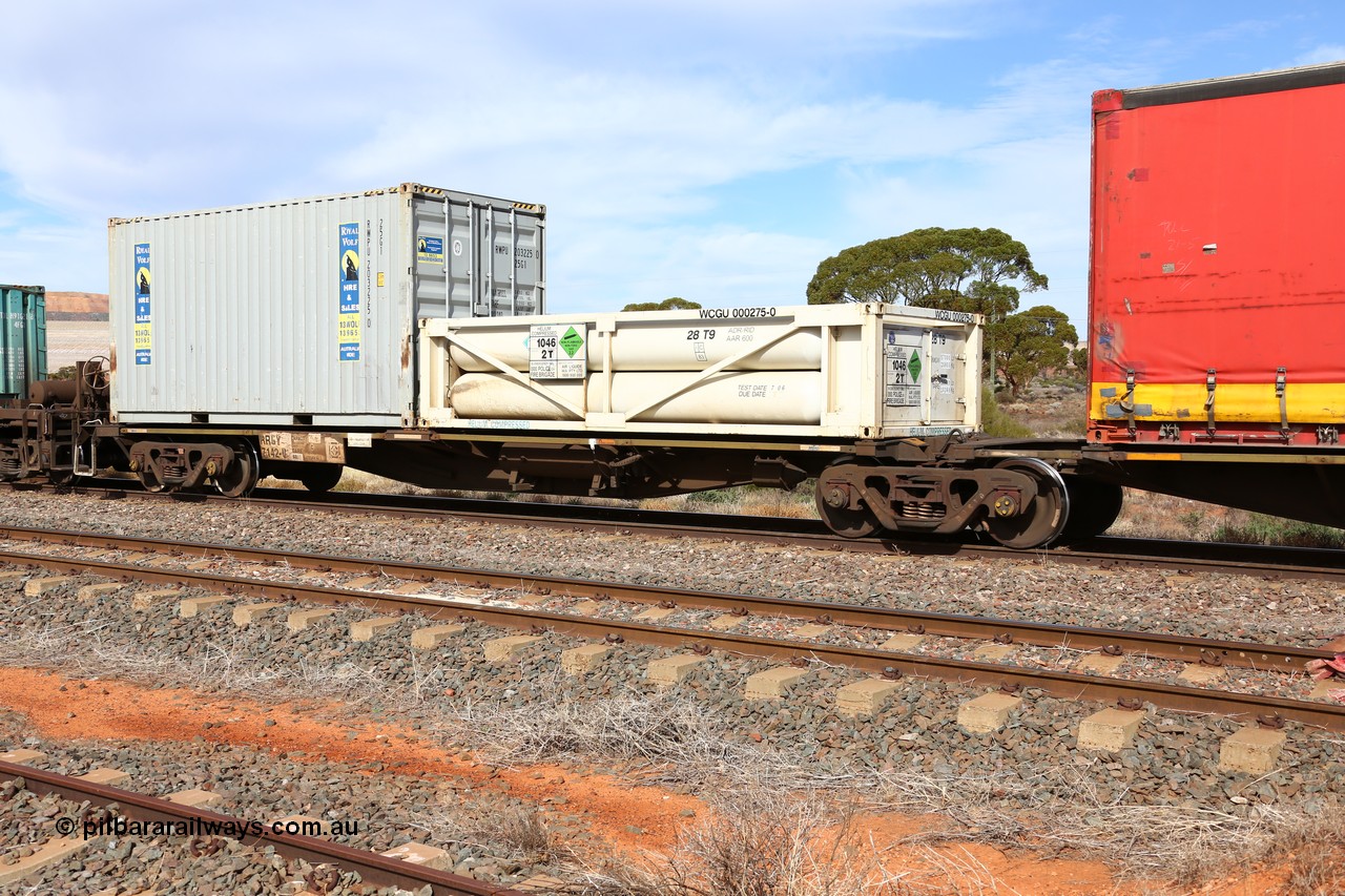 160523 2979
Parkeston, 7SP3 intermodal train, RRGY 7142 platform 1, RRGY type is a 5-pack articulated skeletal container waggon, one of fifty originally built by AN Rail Islington Workshops in 1996-97 as type RRBY, later rebuilt with 48' intermediate decks and recoded to RRGY. Loaded with a half height 20' 28T9 type special tank for compressed helium WCGU 000275 [0] for Aire Liquide and a 20' 25G1 type Royal Wolf container RWPU 203225 [0].
Keywords: RRGY-type;RRGY7142;AN-Islington-WS;RRBY-type;