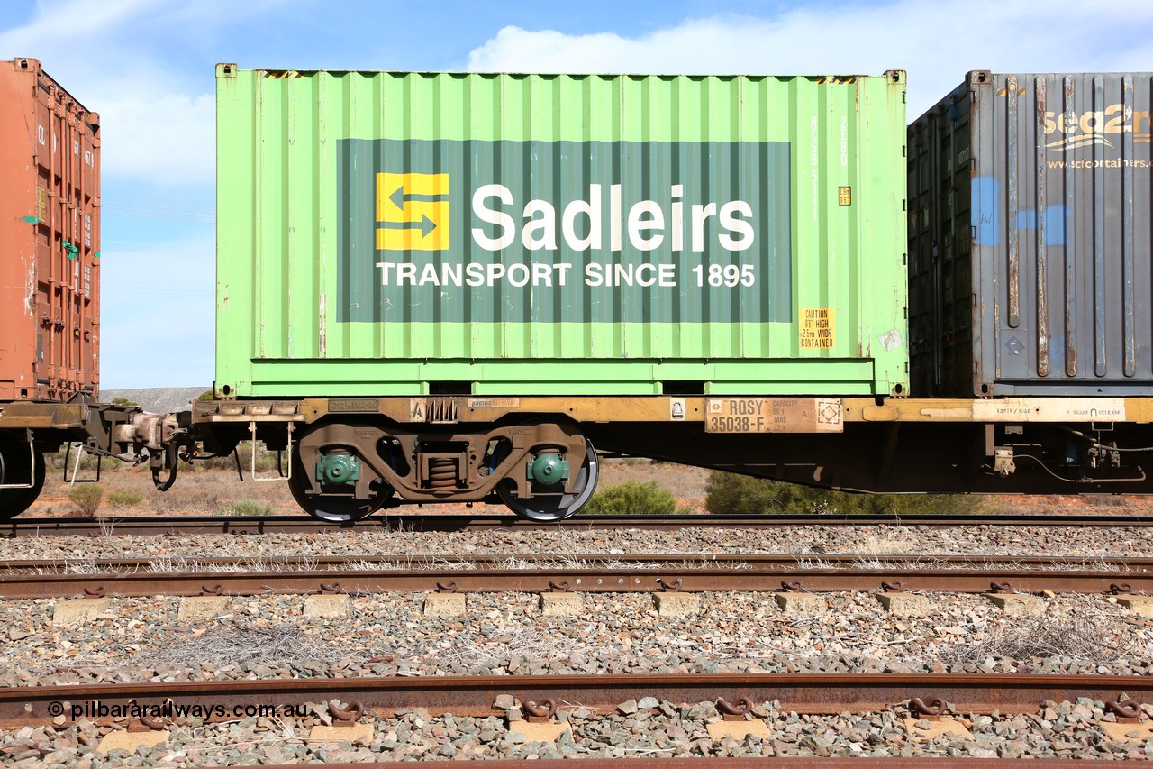 160523 2998
Parkeston, 7SP3 intermodal train, RQSY 35038 63' container waggon, one of a hundred OCY type waggons built by Goninan NSW in 1975, recoded to NQOY, then NQSY. Code board and 2CM bogie view. With a Sadleirs 20' 2EB0 type box RCSB 5111.
Keywords: RQSY-type;RQSY35038;Goninan-NSW;OCY-type;NQOY-type;NQSY-type;