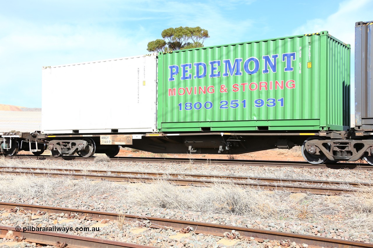 160523 3001
Parkeston, 7SP3 intermodal train, RRGY 7149 platform 1, the RRGY type is a 5-pack articulated skeletal container waggon, fifty were originally built by AN Rail Islington Workshops in 1996-97 as type RRBY, later rebuilt with 48' intermediate decks and recoded to RRGY. Loaded with a Pedemont 20' 2EG1 type box PHR 578 and a Royal Wolf 20' 25G1 type box RWTU 210266 [2].
Keywords: RRGY-type;RRGY7149;AN-Islington-WS;RRBY-type;