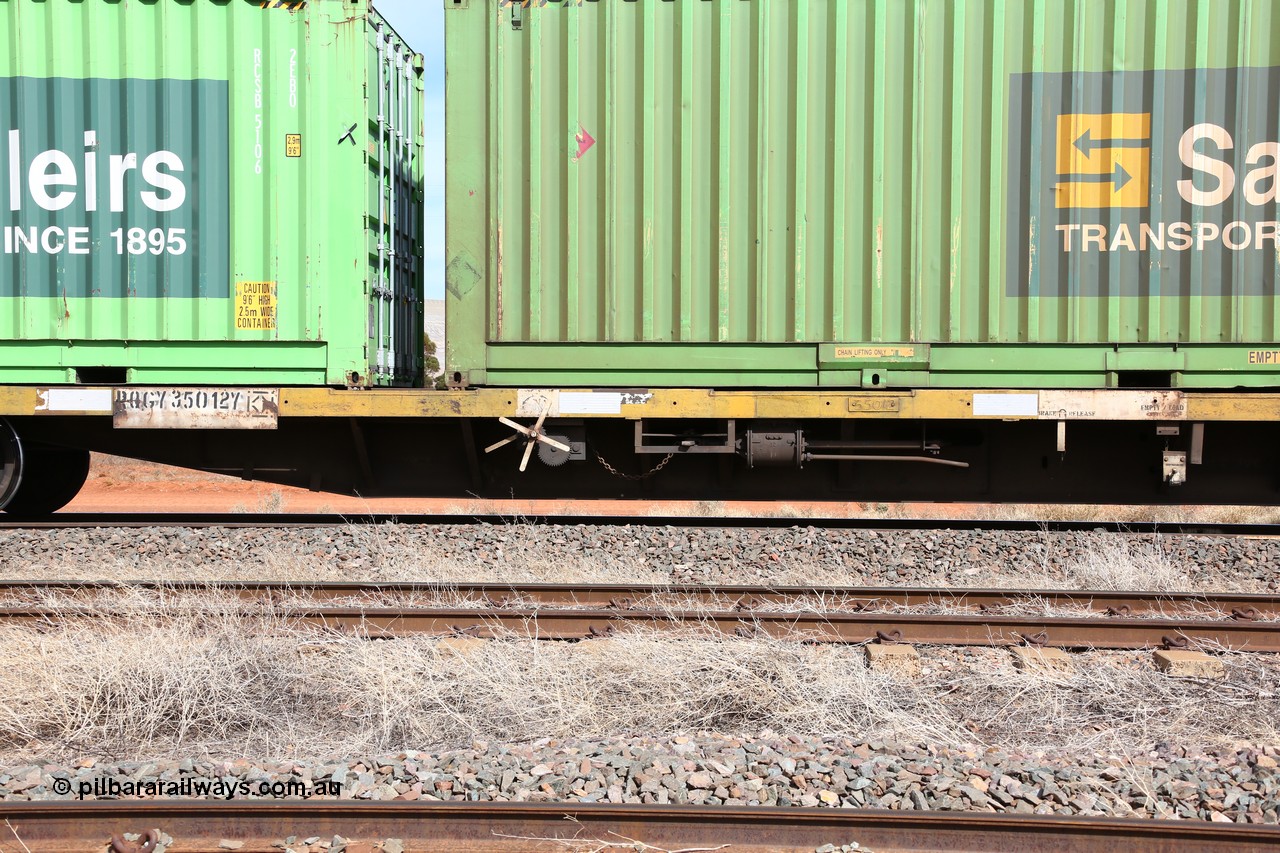 160523 3023
Parkeston, 7SP3 intermodal train, RQGY 35012 63' container waggon, one of a hundred OCY type waggons built by Goninan NSW in 1975, recoded to NQOY, NQSY. Side view of the brake arrangement, code board and number plate with welded numerals.
Keywords: RQGY-type;RQGY35012;Goninan-NSW;OCY-type;