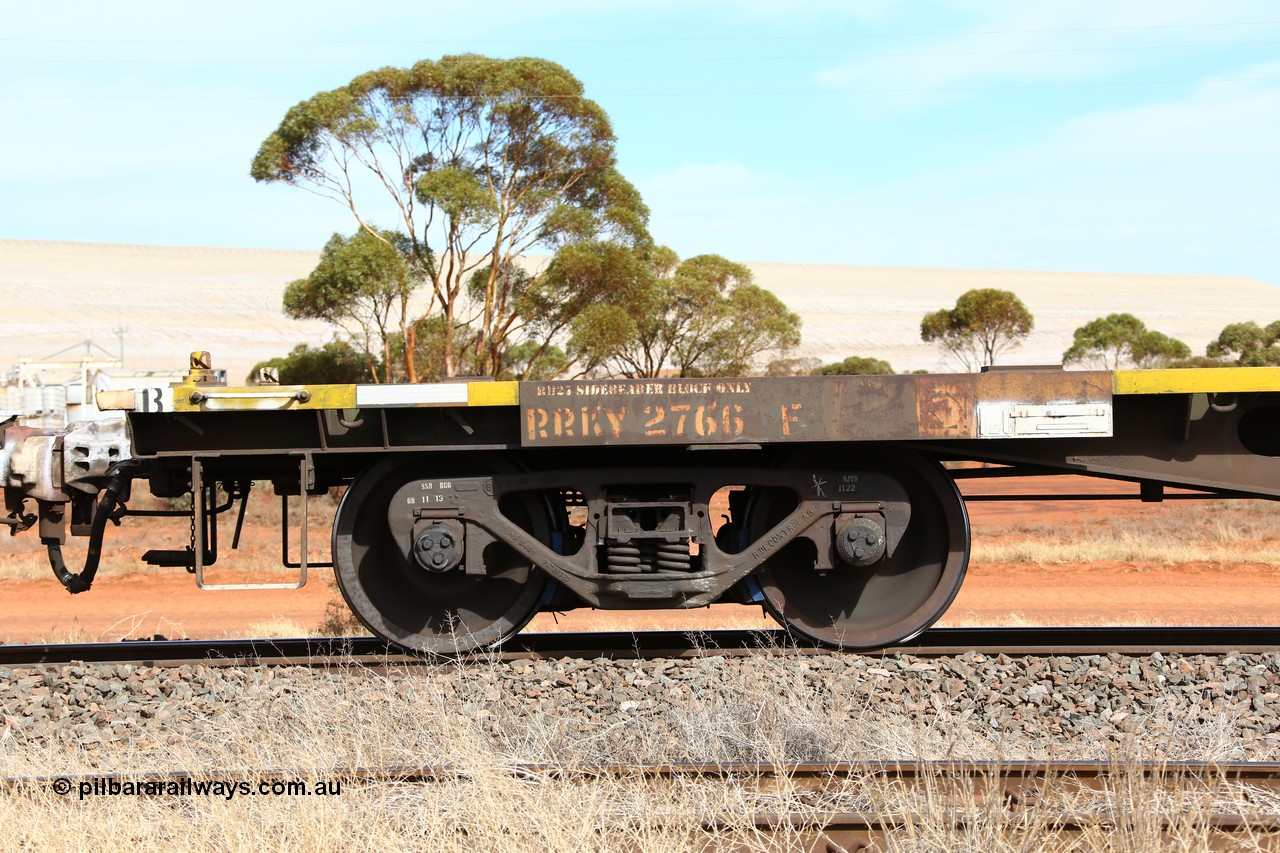 160523 3025
Parkeston, 7SP3 intermodal train, RRKY 2766 container waggon, one of fifty five built by Perry Engineering SA in 1974 as type RMX, recoded to AQMX, AQSY, RQKY. Side view of code board and bogie.
Keywords: RRKY-type;RRKY2766;Perry-Engineering-SA;RMX-type;AQMX-type;AQSY-type;RQKY-type;