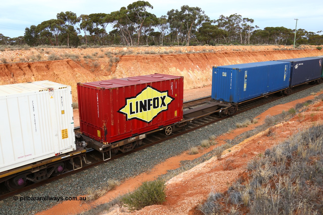 160524 3775
West Kalgoorlie, 2PM6 intermodal train, RQLY 4 platform 5 of 5-pack articulated skeletal waggon set, 1 of 8 built by AN Rail Islington Workshops in 1987 as AQJY, Linfox red 20' box with roof hatches, FSWB 963505 and an empty slot.
Keywords: RQJY-type;RQJY4;AN-Islington-WS;AQJY-type;