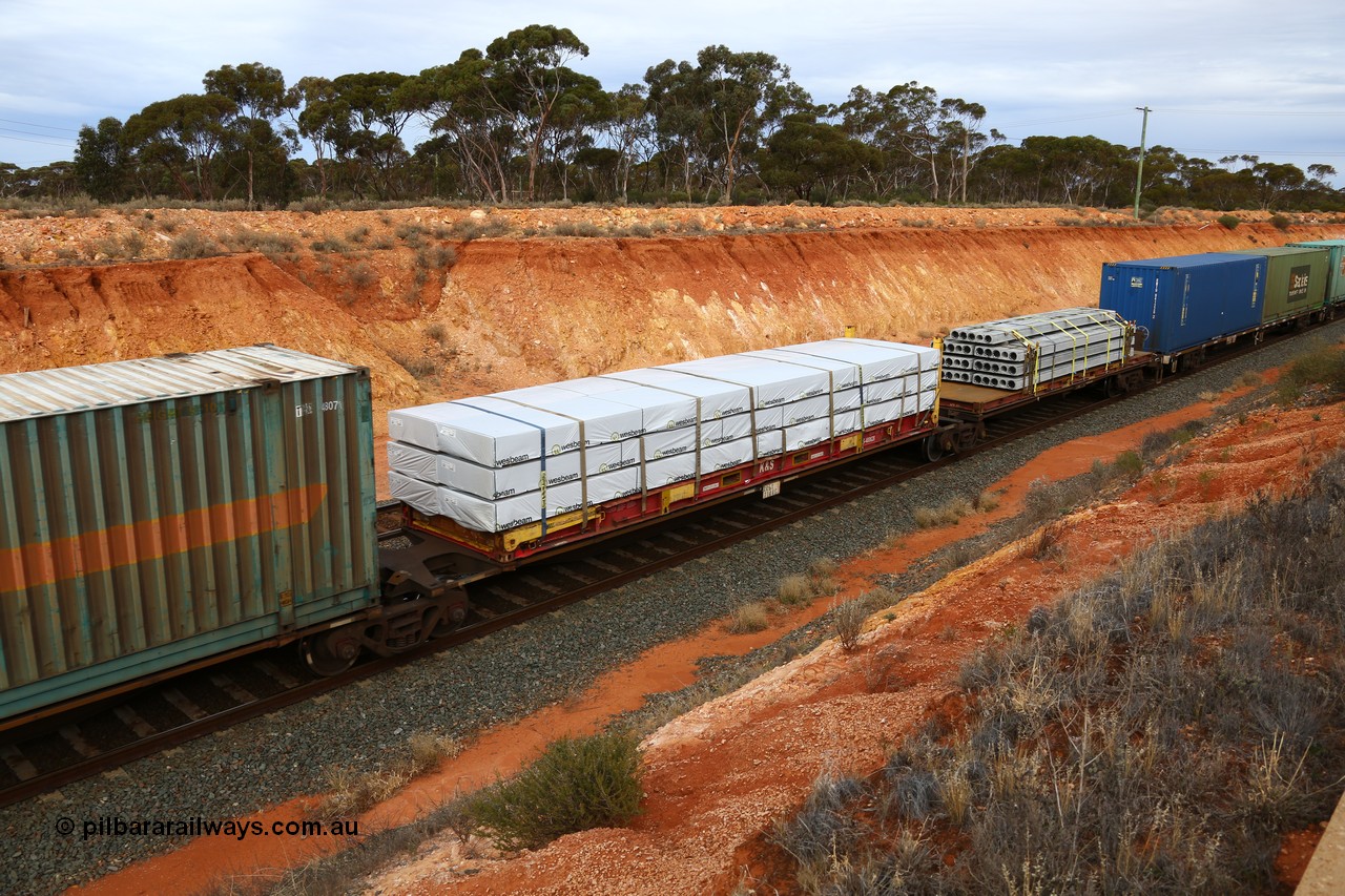 160524 3785
West Kalgoorlie, 2PM6 intermodal train, RRGY 7144 platform 4 of 5-pack articulated skeletal waggon set, one of fifty originally built by AN Rail Islington Workshops in 1996-97 as type RRBY, later rebuilt with 48' intermediate decks and recoded to RRGY, K+S 40' flatrack KHS 400628.
Keywords: RRGY-type;RRGY7144;AN-Islington-WS;RRBY-type;