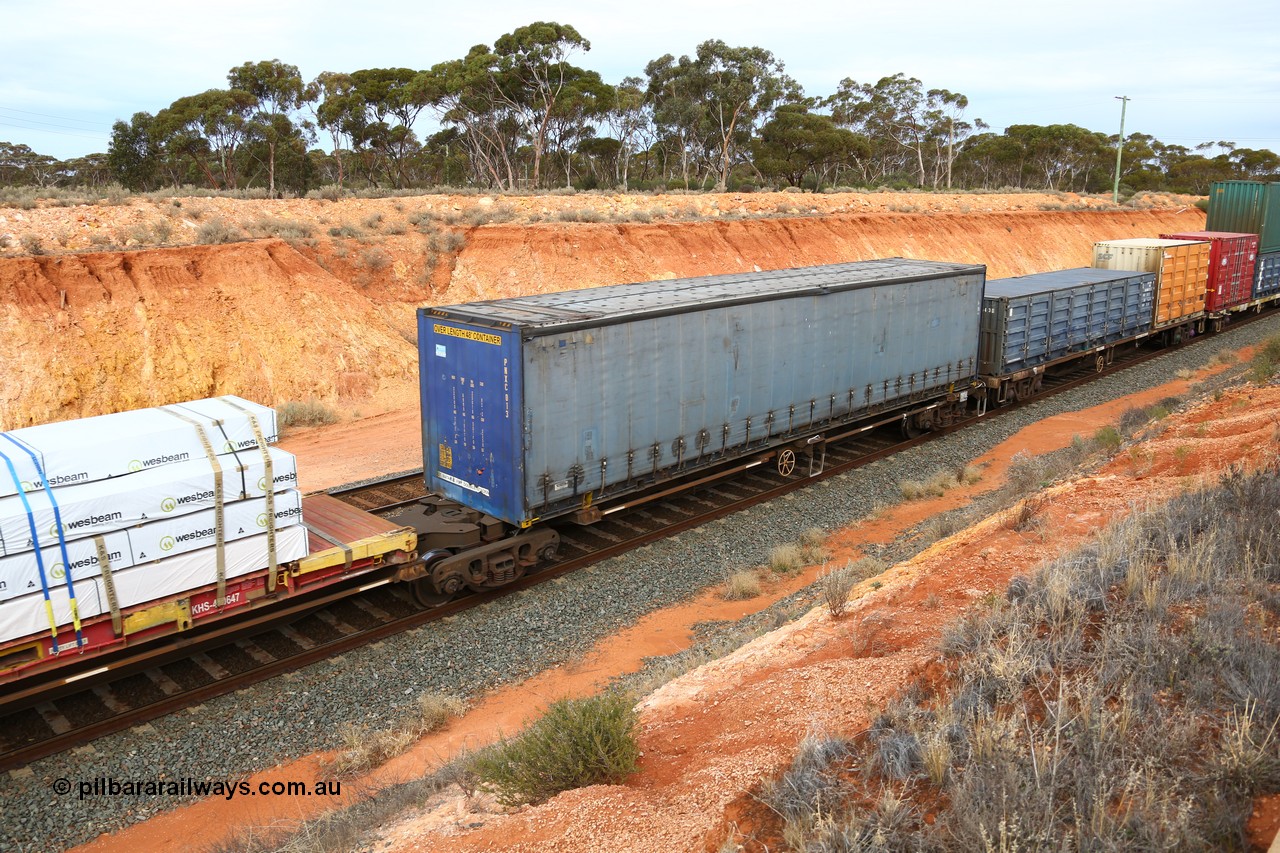 160524 3792
West Kalgoorlie, 2PM6 intermodal train, RRQY 8314 platform 5 of 5-pack articulated skeletal waggon set, built by Qiqihar Rollingstock Works China in 2012, Pacific National 48' curtainsider PNXC 013.
Keywords: RRQY-type;RRQY8314;Qiqihar-Rollingstock-Works-China;