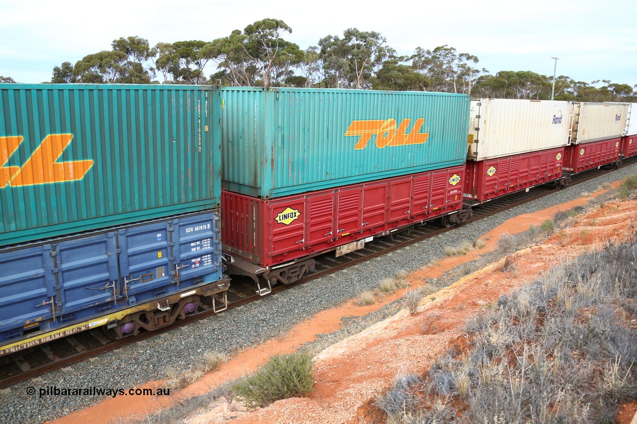 160524 3795
West Kalgoorlie, 2PM6 intermodal train, RRGY 7125 platform 1 of 5-pack articulated skeletal waggon set, one of fifty originally built by AN Rail Islington Workshops in 1996-97 as type RRBY, later rebuilt with 48' intermediate decks and recoded to RRGY, with a Linfox 40' half height side door LSDU 6940030 double stacked with Toll 40' 4FG1 type box TRRC 410629 [1].
Keywords: RRGY-type;RRGY7125;AN-Islington-WS;RRBY-type;