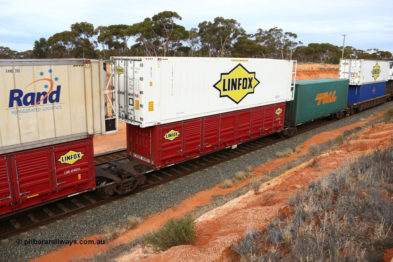 160524 3798
West Kalgoorlie, 2PM6 intermodal train, RRGY 7125 platform 4 of 5-pack articulated skeletal waggon set, one of fifty originally built by AN Rail Islington Workshops in 1996-97 as type RRBY, later rebuilt with 48' intermediate decks and recoded to RRGY, with a Linfox 40' half height side door LSDU 6940087 double stacked with a Linfox 46' MFR3 type reefer FCAD 910611 [6].
Keywords: RRGY-type;RRGY7125;AN-Islington-WS;RRBY-type;