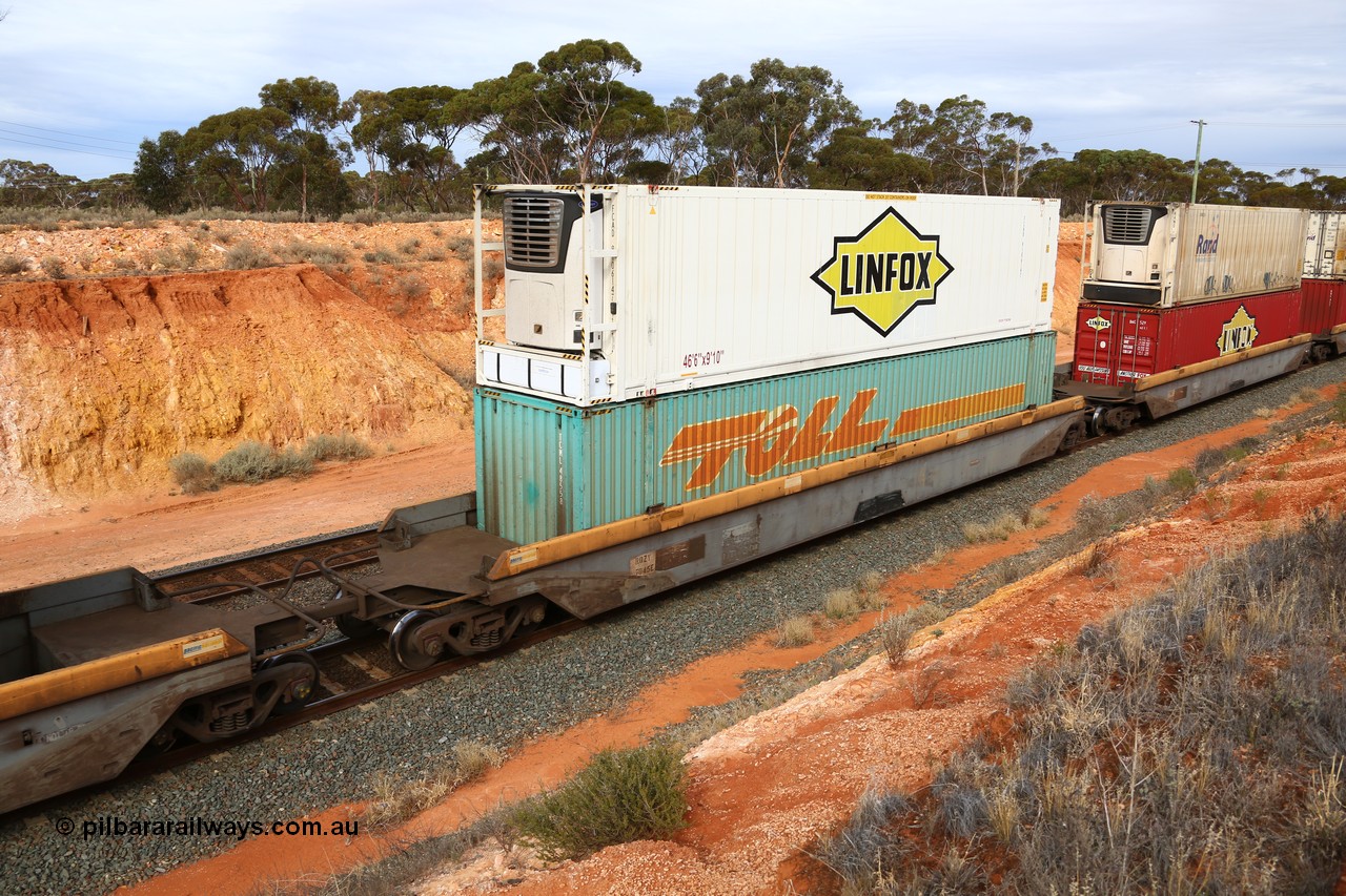 160524 3814
West Kalgoorlie, 2PM6 intermodal train, RQZY 7045 platform 3 of 5-pack well waggon set, one of thirty two sets built by Goninan NSW in 1995-96 for National Rail loaded with Toll 48' container MEG1 type TCML 48558 double stacked with Linfox 46' MFR3 type reefer FCAD 910614 [7].
Keywords: RQZY-type;RQZY7045;Goninan-NSW;