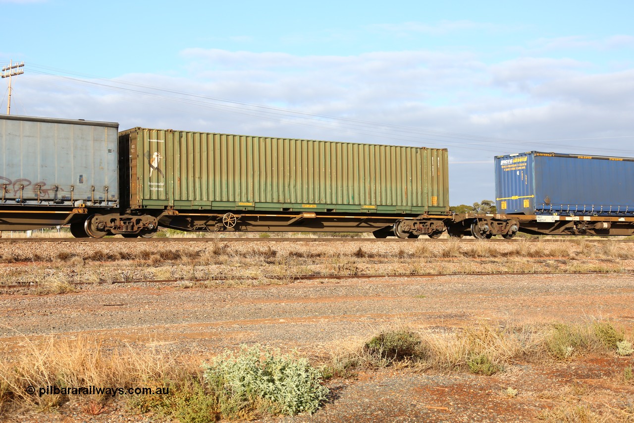 160525 4457
Parkeston, 3PM7 priority service train, RRQY 8408 platform 5 of 5-pack articulated skel waggon, one of thirty four sets built by Qiqihar Rollingstock Works China in 2012, 48' deck with a Intermodal Solutions 48' box RCS 4832.
Keywords: RRQY-type;RRQY8408;Qiqihar-Rollingstock-Works-China;