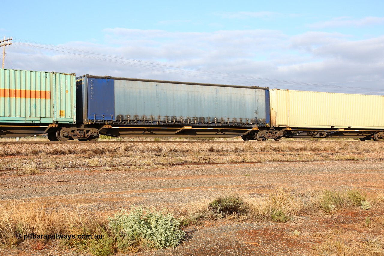 160525 4474
Parkeston, 3PM7 priority service train, RRQY 8516 platform 2 of 5-pack articulated skel waggon, one of thirty four sets built by Qiqihar Rollingstock Works China in 2012, 48' deck with a Pacific National 48' curtainsider PNXM 4529.
Keywords: RRQY-type;RRQY8516;Qiqihar-Rollingstock-Works-China;