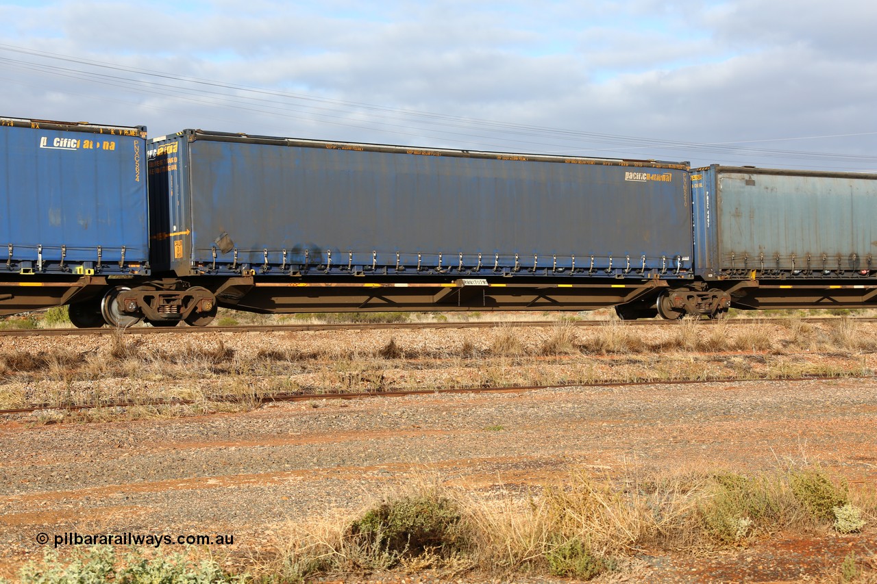 160525 4504
Parkeston, 3PM7 priority service train, RQQY 7079 platform 3 of 5-pack articulated skel waggon set, one of seventeen sets built by Qld Rail at Ipswich Workshops in 1995, 48' Pacific National curtainsider PNXM 5210.
Keywords: RQQY-type;RQQY7079;Qld-Rail-Ipswich-WS;