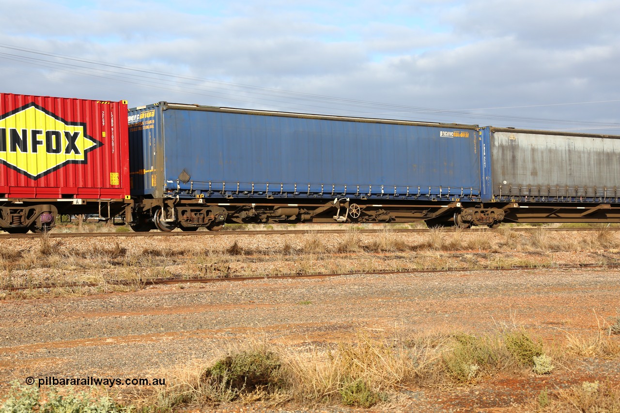 160525 4526
Parkeston, 3PM7 priority service train, RRQY 8344 platform 5 of 5-pack articulated skel waggon set the last of a batch of 41 built by Qiqihar Rollingstock Works China in 2005 for Pacific National, with a Pacific National 48' curtainsider PNXM 5225.
Keywords: RRQY-type;RRQY8344;Qiqihar-Rollingstock-Works-China;