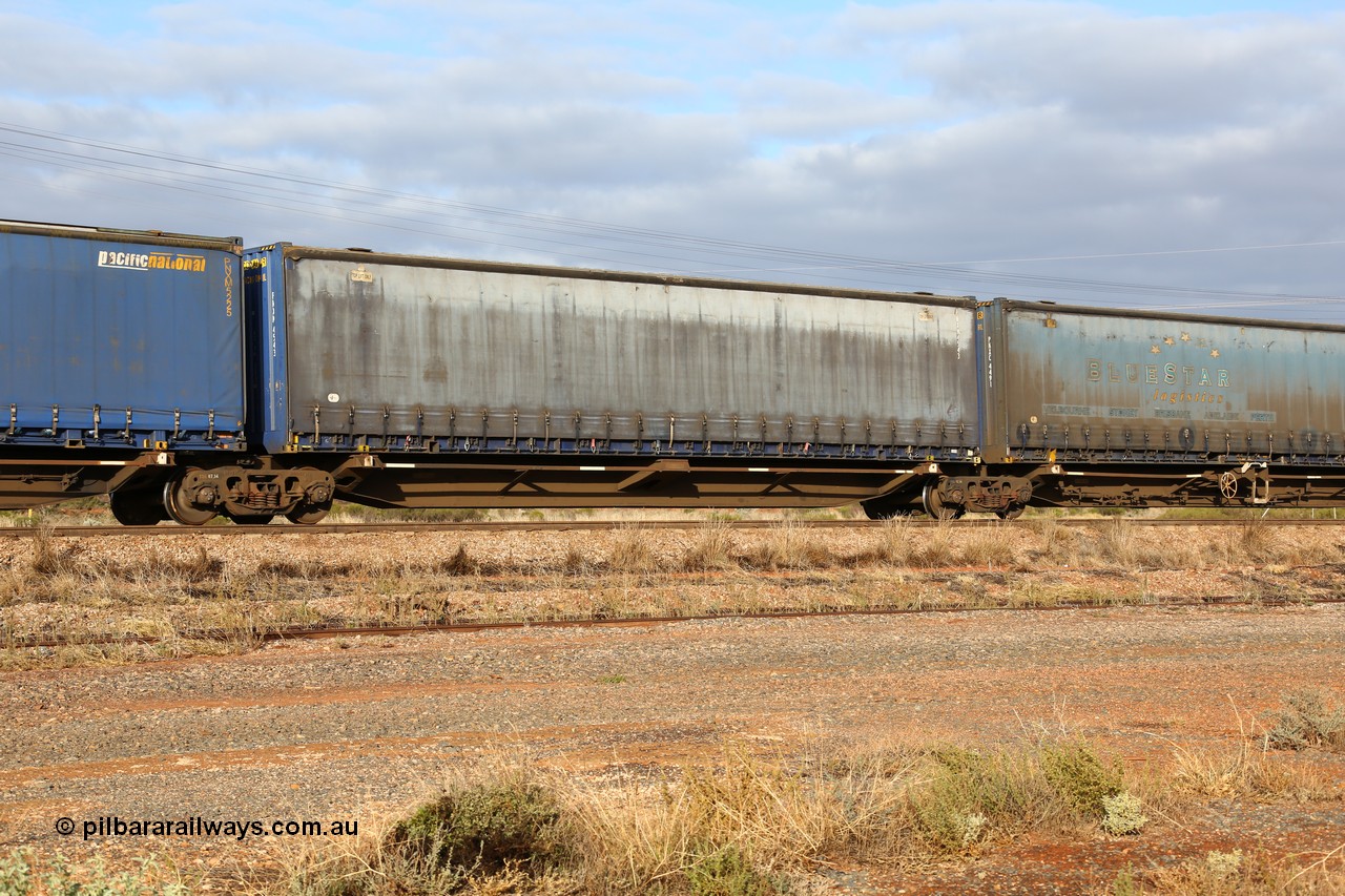 160525 4527
Parkeston, 3PM7 priority service train, RRQY 8344 platform 4 of 5-pack articulated skel waggon set the last of a batch of 41 built by Qiqihar Rollingstock Works China in 2005 for Pacific National, with a Pacific National 48' curtainsider PNXM 4543.
Keywords: RRQY-type;RRQY8344;Qiqihar-Rollingstock-Works-China;