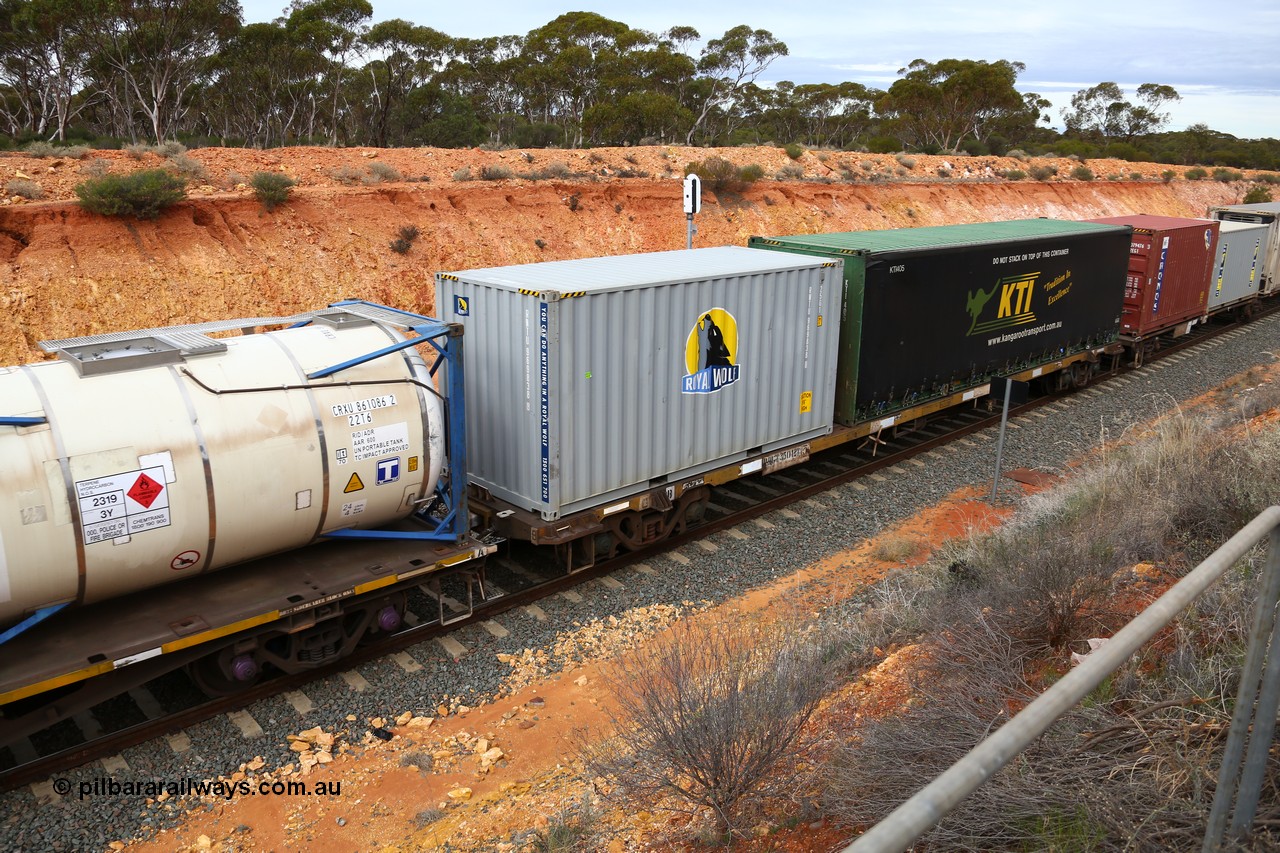 160526 5211
West Kalgoorlie, 4PM6 intermodal train, RQGY 35012 container waggon, one of a batch of one hundred built by Goninan NSW in 1975 as OCY class, recoded to NQOY, then NQSY, 20' Royal Wolf box RWTU 969838 and a 40' curtainsider for KTI, KTI 405.
Keywords: RQGY-type;RQGY35012;Goninan-NSW;OCY-type;NQOY-type;NQSY-type;