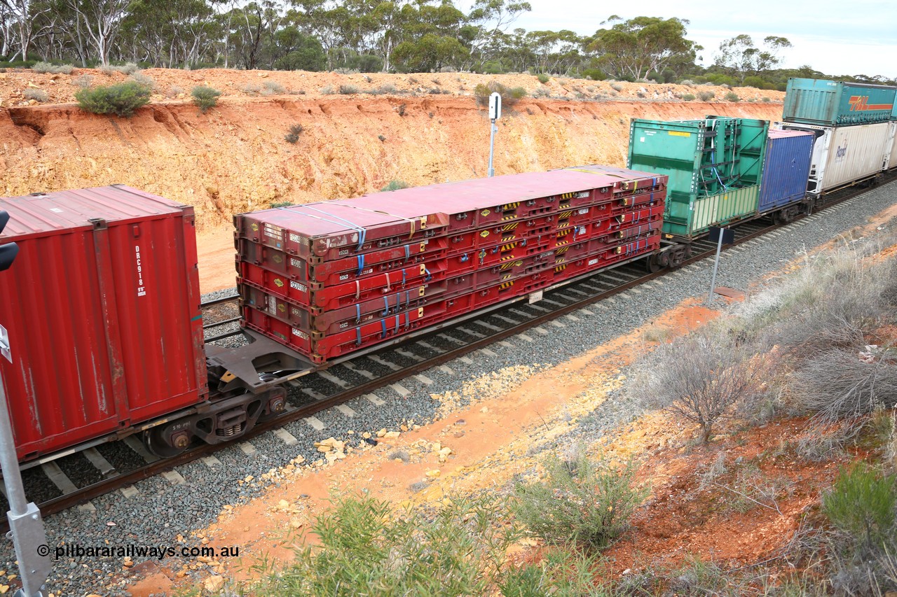 160526 5244
West Kalgoorlie, 4PM6 intermodal train, RRGY 7119 platform 2 of 5-pack articulated skel waggon, one of fifty originally built by AN Rail Islington Workshops in 1996-97 as class RRBY, later rebuilt with 48' intermediate decks and coded RRGY, 48' deck with a stack of five Linfox 40' FCCU class flatracks.
Keywords: RRGY-type;RRGY7119;AN-Islington-WS;RRBY-type;