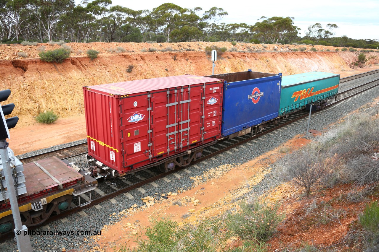160526 5251
West Kalgoorlie, 4PM6 intermodal train, RQWW 22015 container waggon, one of thirty two built by Comeng NSW in 1973-75 as JCW class, recoded to NQJW with a Cahill 20' side door CHLL 200040, 20' open top Railroad Transport RTP 2011 and a Toll 40' half height curtainsider.
Keywords: RQWW-type;RQWW22015;Comeng-NSW;JCW-type;NQJW-type;