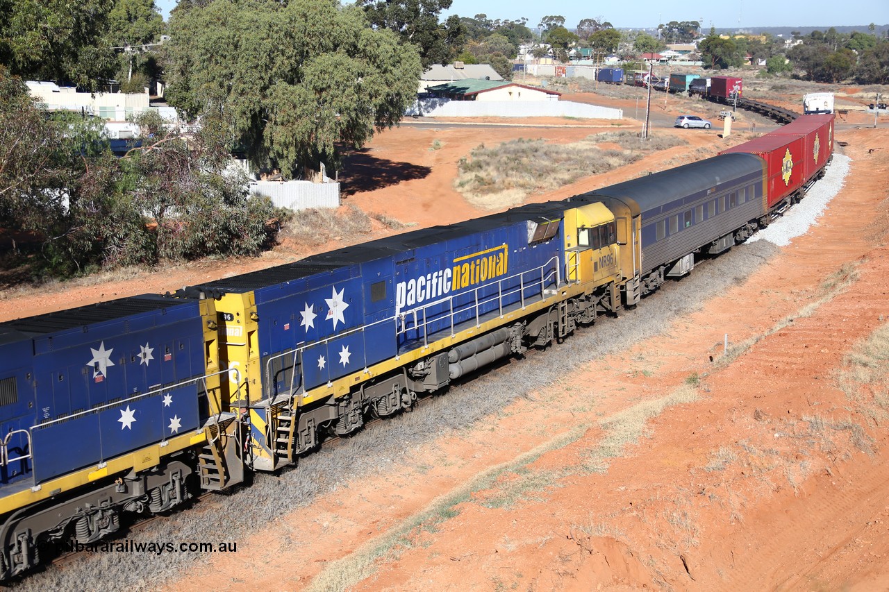 160527 5515
Kalgoorlie, 5PS6 intermodal train powers away from Kalgoorlie as it is about to pass under the Goldfields Highway, Goninan built GE model Cv40-9i NR class unit NR 96 serial 7250-06/97-297 and crew coach RZEY 3.
Keywords: NR-class;NR96;Goninan;GE;Cv40-9i;7250-06/97-297;