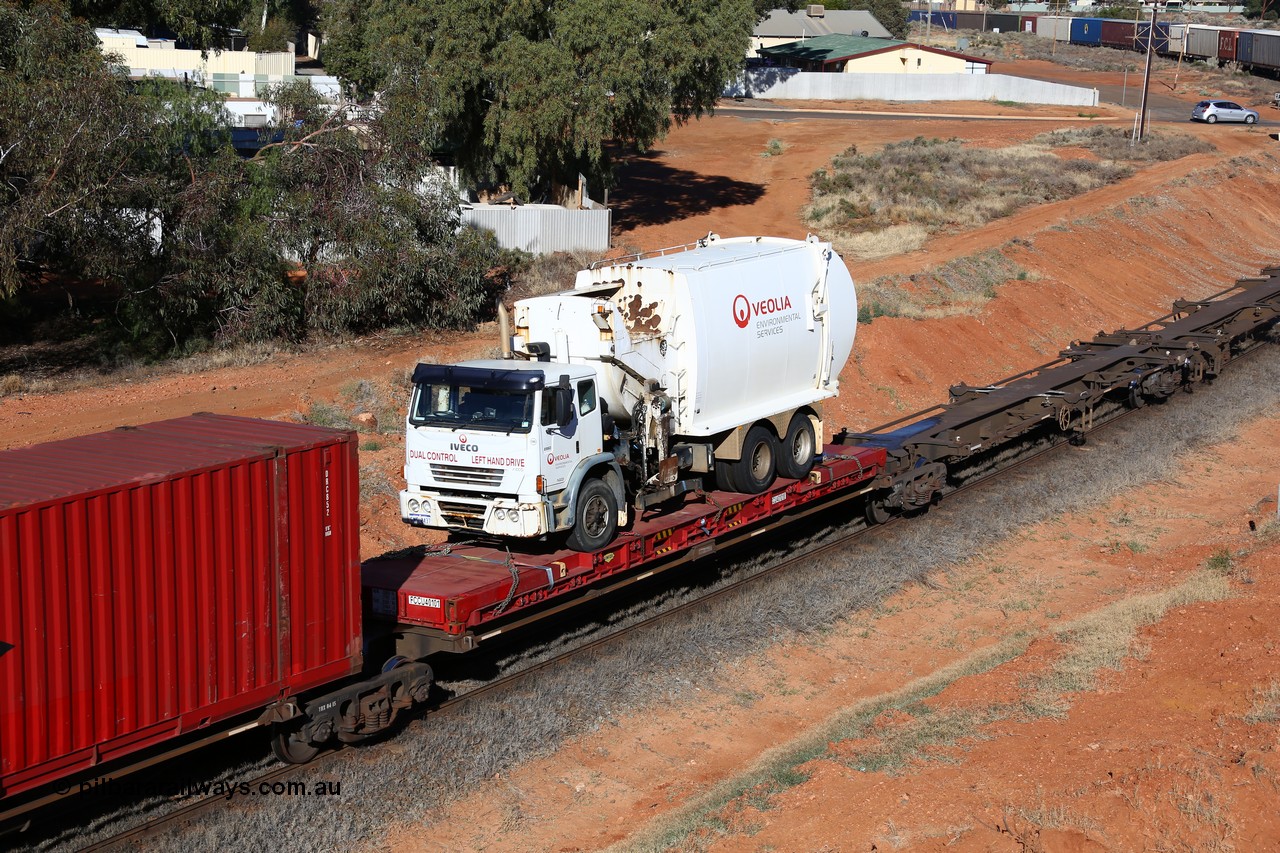 160527 5517
Kalgoorlie, 5PS6 intermodal train, platform 4 of 5-pack RRQY 8332 articulated skel waggon, built by Qiqihar Rollingstock Works China in 2012 with a Linfox flatrack FCCU 40101 loaded with a Veolia rubbish truck.
Keywords: RRQY-type;RRQY8332;Qiqihar-Rollingstock-Works-China;