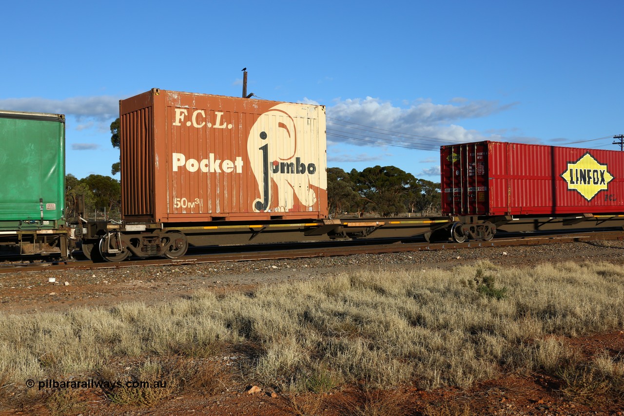 160528 8324
Parkeston, priority service 6PS7, RQQY 7083 platform 5 of 5-pack articulated skel waggon set, one of seventeen sets built by Qld Rail at Ipswich Workshops in 1995, with an FCL 20' Pocket Jumbo 50 m3 box FPJG 201008.
Keywords: RQQY-type;RQQY7083;Qld-Rail-Ipswich-WS;