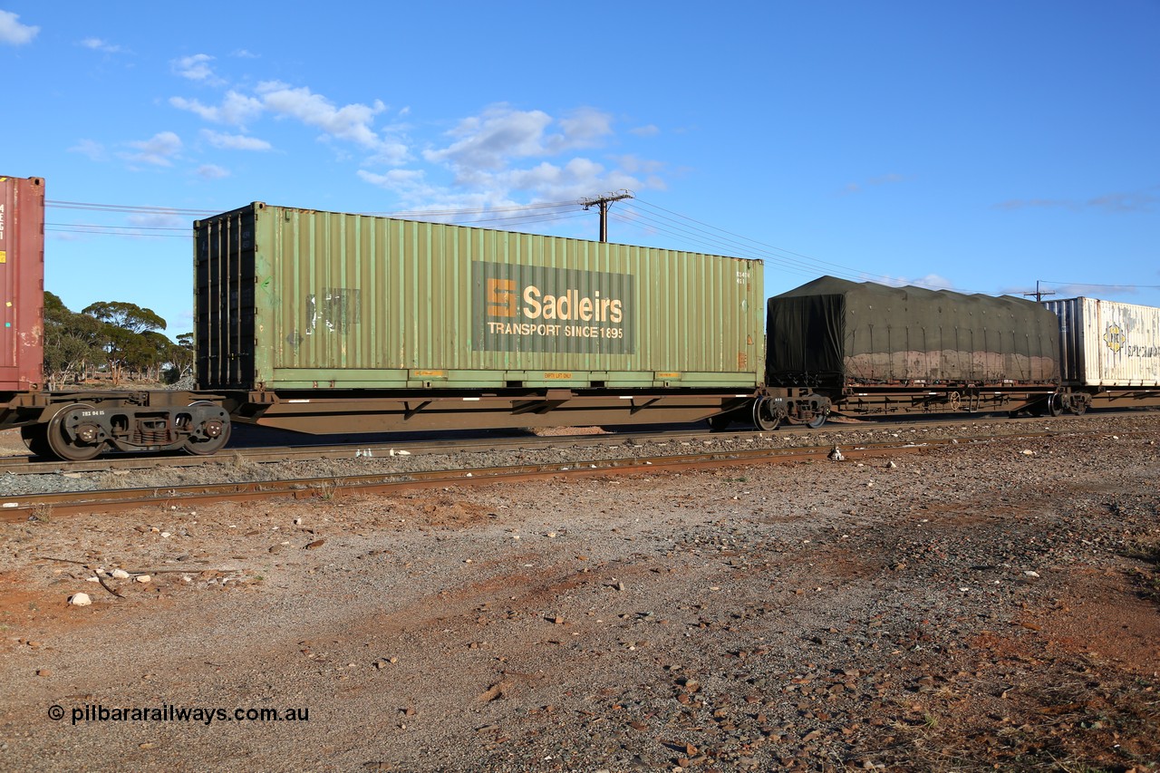 160528 8360
Parkeston, 5SP5 intermodal train, PRXY 5004 originally owned by FCL, five PRXY type articulated five pack container waggon sets with 48' decks were built by Qiqihar Rollingstock Works in China in 2005, with a Sadleirs 40' 4EG1 type box RCS 4094.
Keywords: PRXY-type;PRXY5004;Qiqihar-Rollingstock-Works-China;