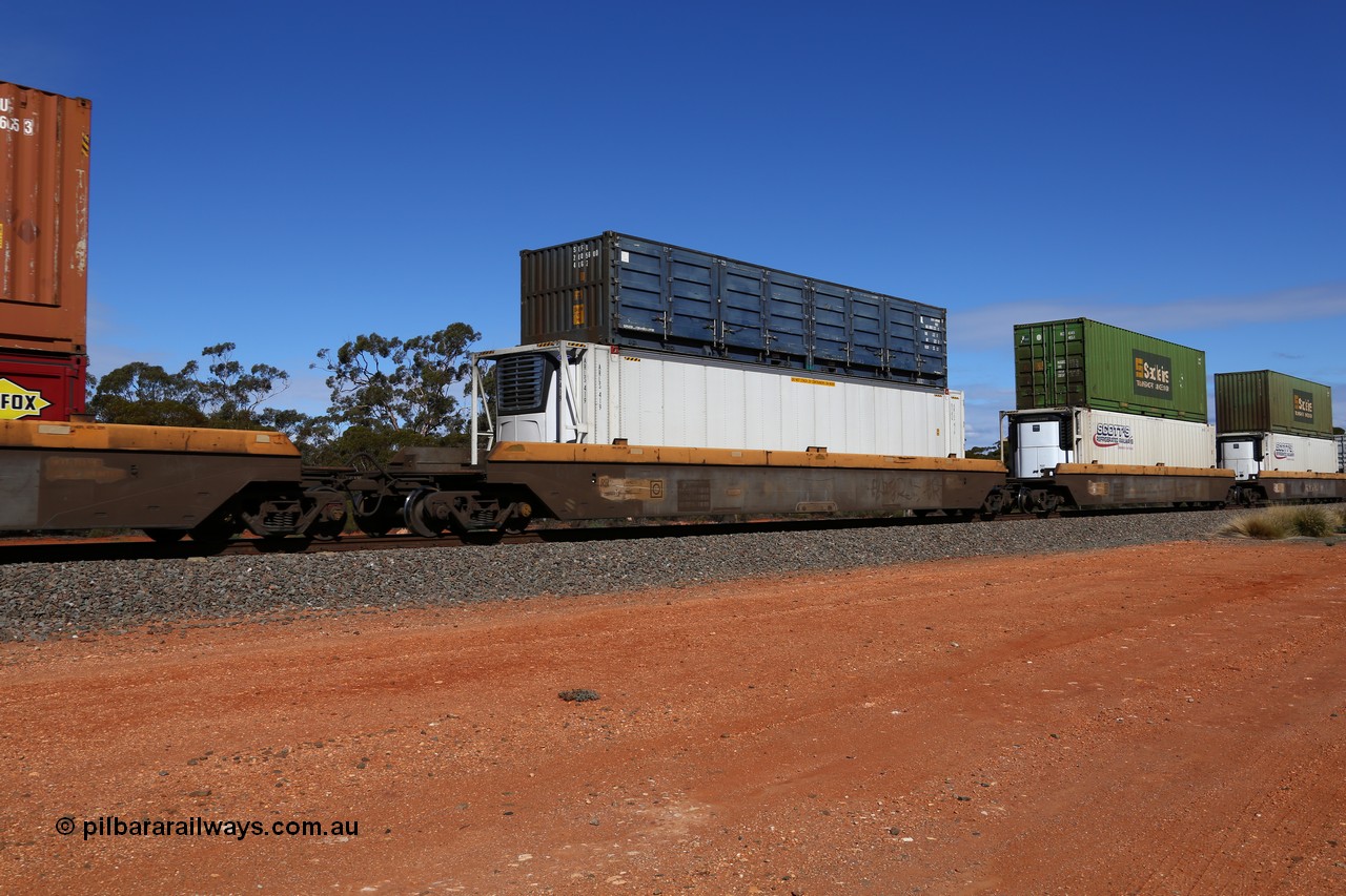 160528 8455
Binduli, intermodal train 6PM6, RRZY type five unit bar coupled well container waggon set RRZY 7039 platform 3, one of thirty two waggon sets built by Goninan in 1995-96 for National Rail as the RQZY type and recoded when repaired. Loaded with an ARLS 46' RFRG type reefer ARLS 419 and double stacked with an SCF 40' 4CG2 type half height side door container 2005600 [0].
Keywords: RRZY-type;RRZY7039;Goninan-NSW;RQZY-type;