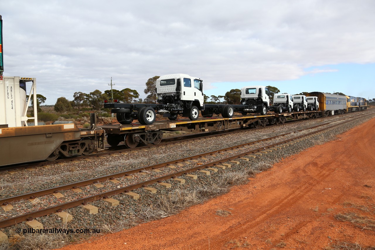 160529 8765
Parkeston, 6MP4 intermodal train, RRKY 4335 container waggon, originally built in a batch of one hundred and fifty by Perry Engineering SA in 1975 as RMX type, recoded to AQMX, and RQKY, loaded with two Isuzu cab-chassis trucks.
Keywords: RRKY-type;RRKY4335;Perry-Engineering-SA;RMX-type;AQMX-type;RQKY-type;