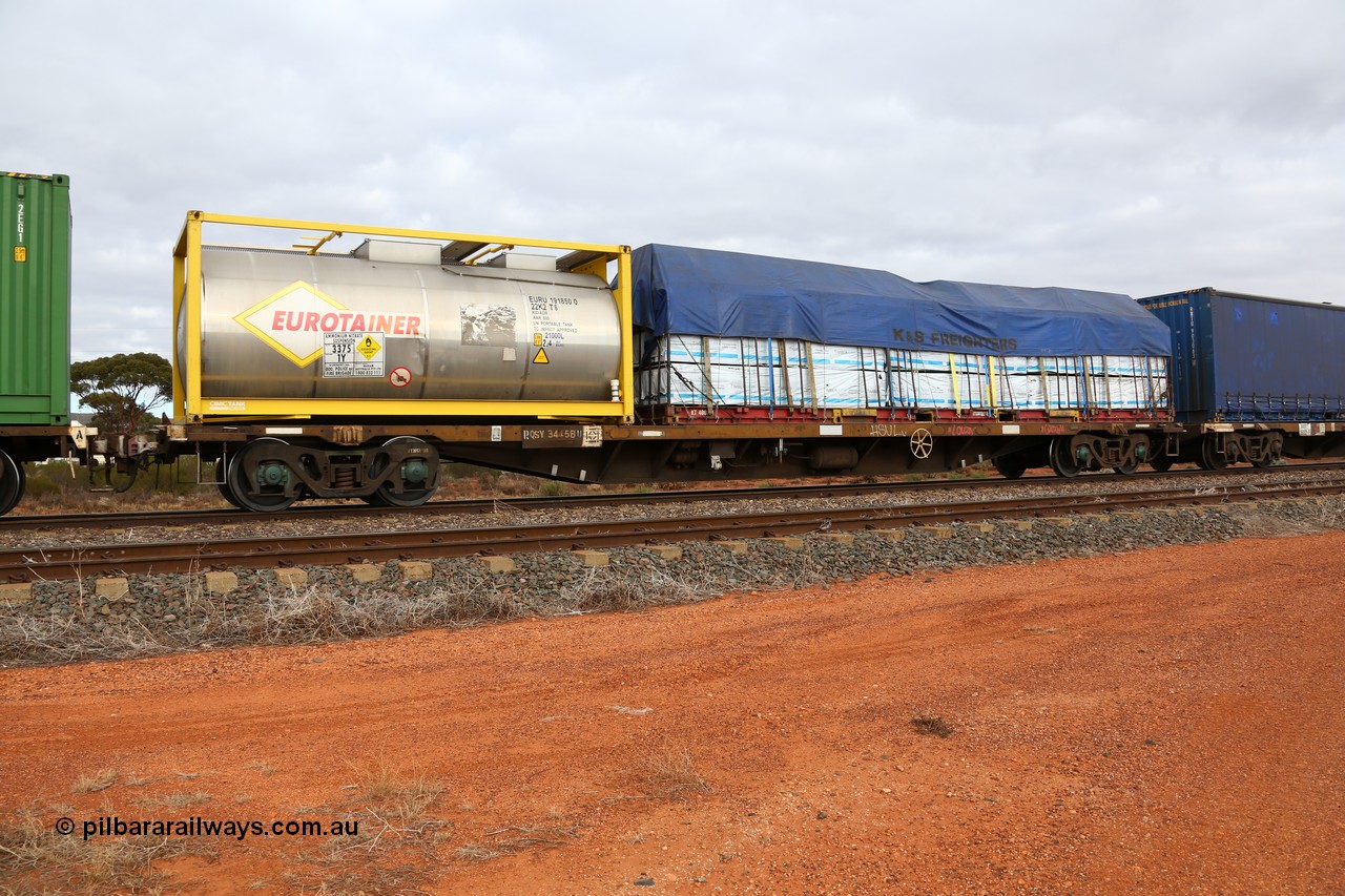 160529 8779
Parkeston, 6MP4 intermodal train, RQSY 34458 one of one hundred OCY type container flat waggons built by Tulloch Ltd NSW in 1974/75, recoded to NQOY, then NQSY. Loaded with a 20' CIMC Tank built Eurotainer ISO tanktainer 22K2 type EURU 191850 for ammonium nitrate solution and a 40' K&S flat rack KT 400201 with a tarped load of timber products.
Keywords: RQSY-type;RQSY34458;Tulloch-Ltd-NSW;OCY-type;NQOY-type;