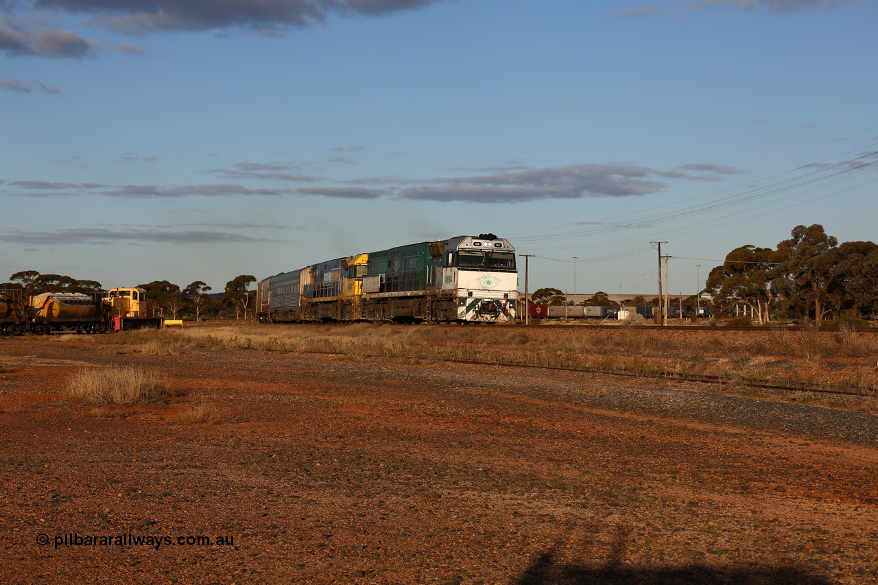 160529 9077
Parkeston, 7MP7 priority service train powers around the curve as it climbs the grade to Kalgoorlie behind a pair of Goninan built GE model Cv40-9i NR class units NR 84 serial 7250-04/97-286 and NR 80 serial 7250-03/97-282. NR 84 wears the Southern Spirit livery and is known as the Minty. Off to the left is Loongana Lime shunt loco DE 49, a former BHP 37 class unit built by Goninan in 1961 based on GE 80 ton switcher, serial 4970-013.
Keywords: NR-class;NR84;NR80;Goninan;GE;Cv40-9i;7250-04/97-286;7250-03/97-282;