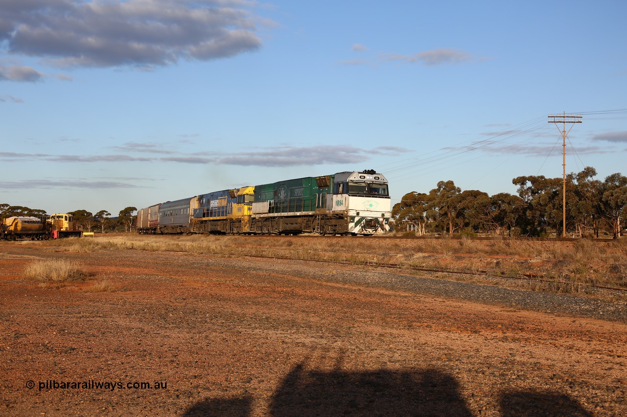 160529 9078
Parkeston, 7MP7 priority service train powers around the curve as it climbs the grade to Kalgoorlie behind a pair of Goninan built GE model Cv40-9i NR class units NR 84 serial 7250-04/97-286 and NR 80 serial 7250-03/97-282. NR 84 wears the Southern Spirit livery and is known as the Minty. Off to the left is Loongana Lime shunt loco DE 49, a former BHP 37 class unit built by Goninan in 1961 based on GE 80 ton switcher, serial 4970-013.
Keywords: NR-class;NR84;NR80;Goninan;GE;Cv40-9i;7250-04/97-286;7250-03/97-282;