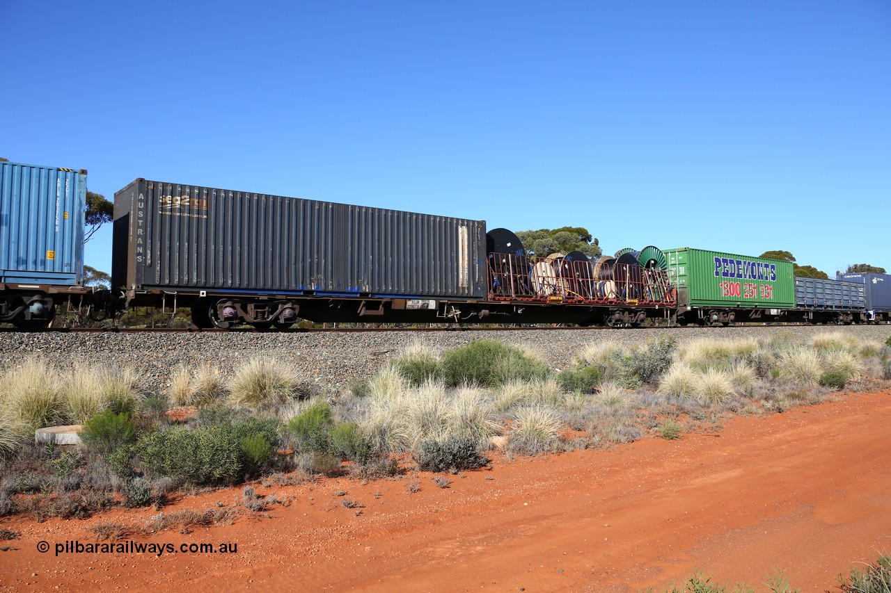 160530 9252
Binduli, 7SP3 intermodal service, container waggon RQJW 22067, one of fifty built by Mittagong Engineering NSW in 1975-76 as JCW type, recoded to NQJW. Loaded with an 40' FD type flatrack with cable drums and a 40' SCF - Austrans sea2rail container AUSU 408190.
Keywords: RQJW-type;RQJW22067;Mittagong-Engineering-NSW;JCW-type;NQJW-type;