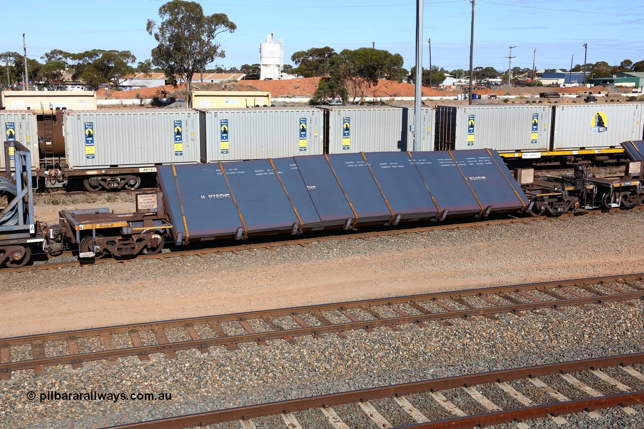 160531 9927
West Kalgoorlie, 1MP2 steel train, RKYY type wide steel plate tilt waggon RKYY 7088, one of twenty seven units built by AN Rail Islington Workshops in 1995-96. Loaded with steel plate.
Keywords: RKYY-type;RKYY7088;AN-Islington-WS;