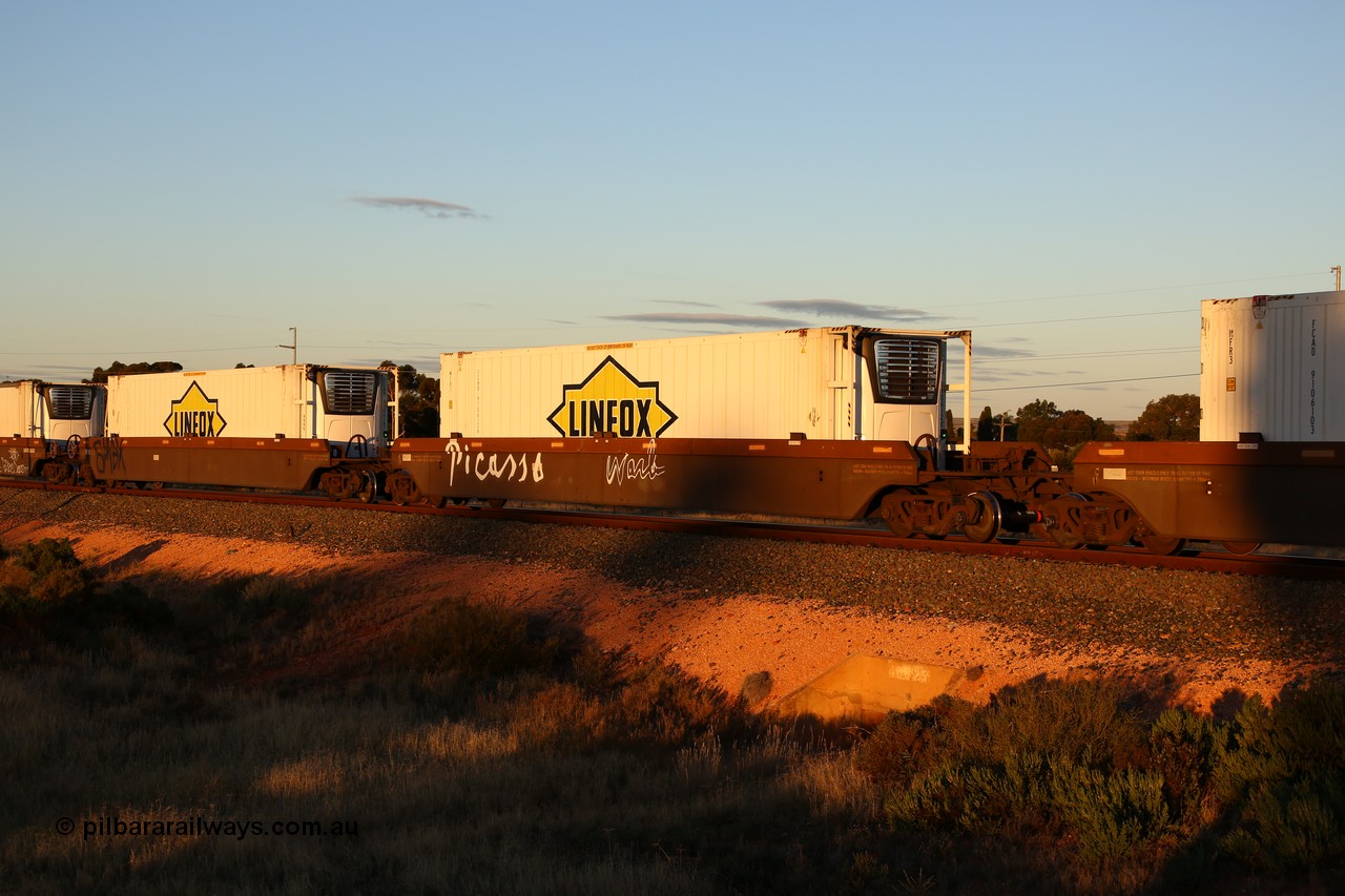 160601 10103
West Kalgoorlie, 2MP5 intermodal train, platform 3 of 5-pack RRRY 7011 well waggon set, one of nineteen built in China at Zhuzhou Rolling Stock Works for Goninan in 2005, Linfox 46' reefer FCAD 910612.
Keywords: RRRY-type;RRRY7011;CSR-Zhuzhou-Rolling-Stock-Works-China;