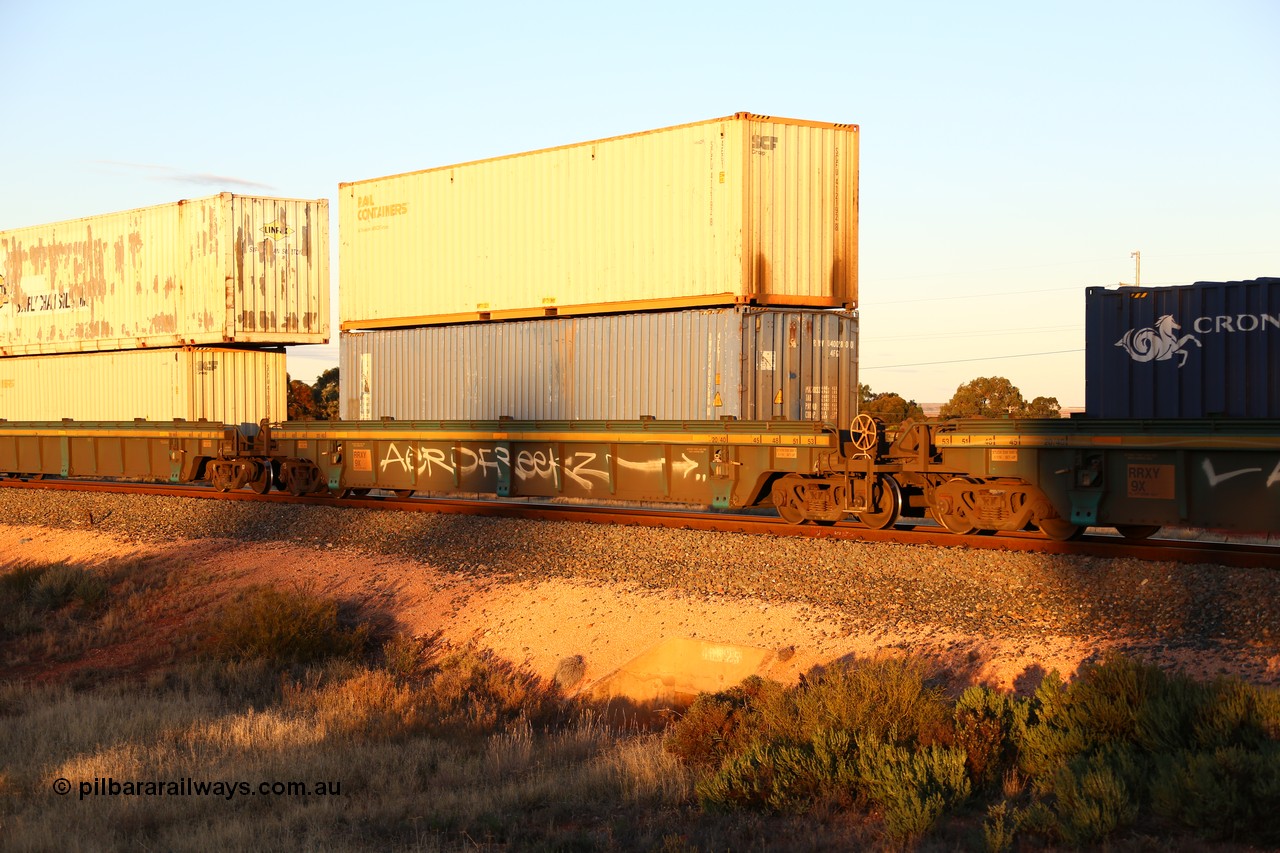 160601 10117
West Kalgoorlie, 2MP5 intermodal train, RRXY 9 platform 2 of 5-pack well waggon set, one of eleven built by Bradken Qld in 2002 for Toll from a Worley-Williams design with a 40' Royal Wolf plain blue box in the well RWVU 400280 and Rail Containers SCFU 412192 on top.
Keywords: RRXY-type;RRXY9;Worley-Williams;Bradken-Rail-Qld;