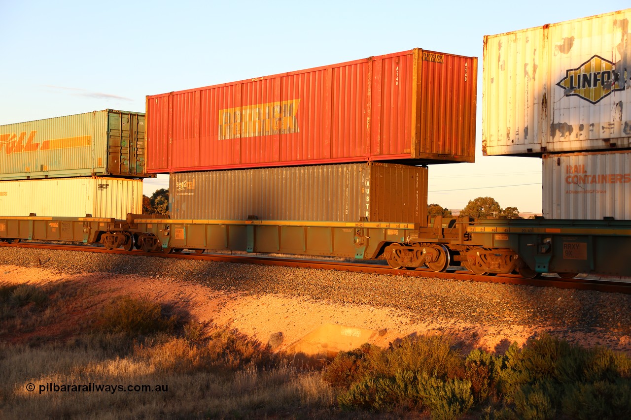 160601 10119
West Kalgoorlie, 2MP5 intermodal train, RRXY 9 platform 4 of 5-pack well waggon set, one of eleven built by Bradken Qld in 2002 for Toll from a Williams-Worley design with a 40' sea2rail Austrans box AUSU 407179 in the well and a 53' Patrick automobile box A 140 on top.
Keywords: RRXY-type;RRXY9;Williams-Worley;Bradken-Rail-Qld;