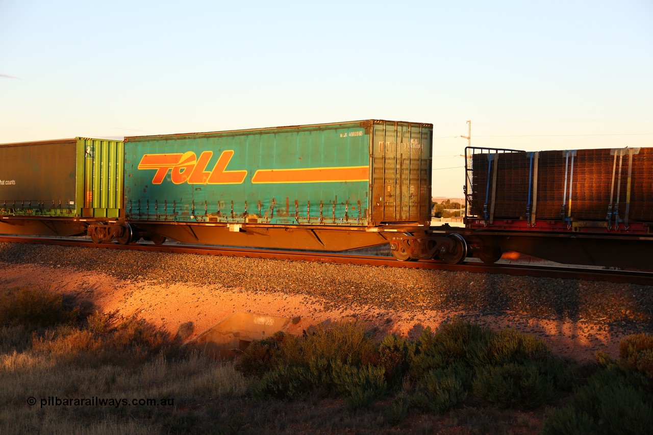 160601 10142
West Kalgoorlie, 2MP5 intermodal train, RRAY 7163 platform 3 of 5-pack articulated skel waggon set, 1 of 100 built by ABB Engineering NSW 1996-2000, 48' deck with a 40' Toll curtainsider MLJL 496096, a former Interlink box.
Keywords: RRAY-type;RRAY7163;ABB-Engineering-NSW;